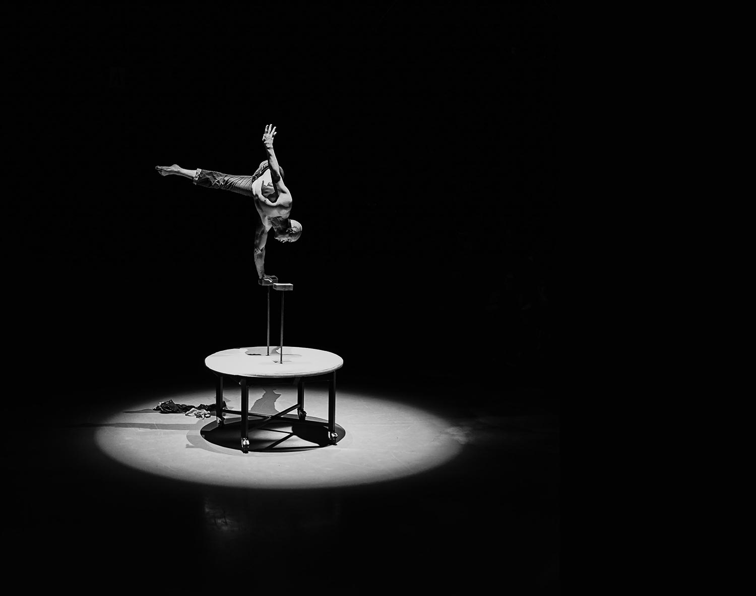 Male dancer performing an acrobatic stunt.